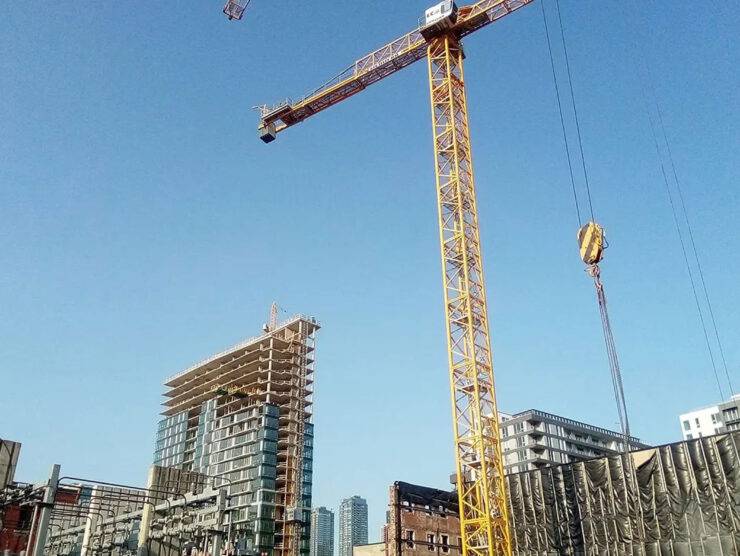 commercial plumbing job construction site large crane