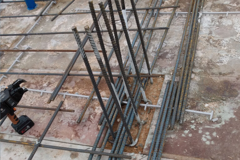 commercial plumbing job construction site metal rods