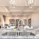 kitchen with marble counter tops and silver sink